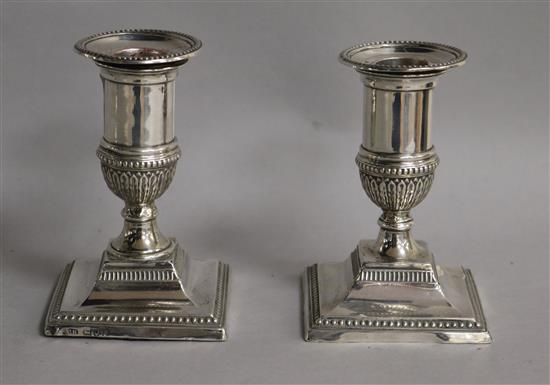 A pair of Edwardian silver dwarf candlesticks, London, 1901, 10.5cm.